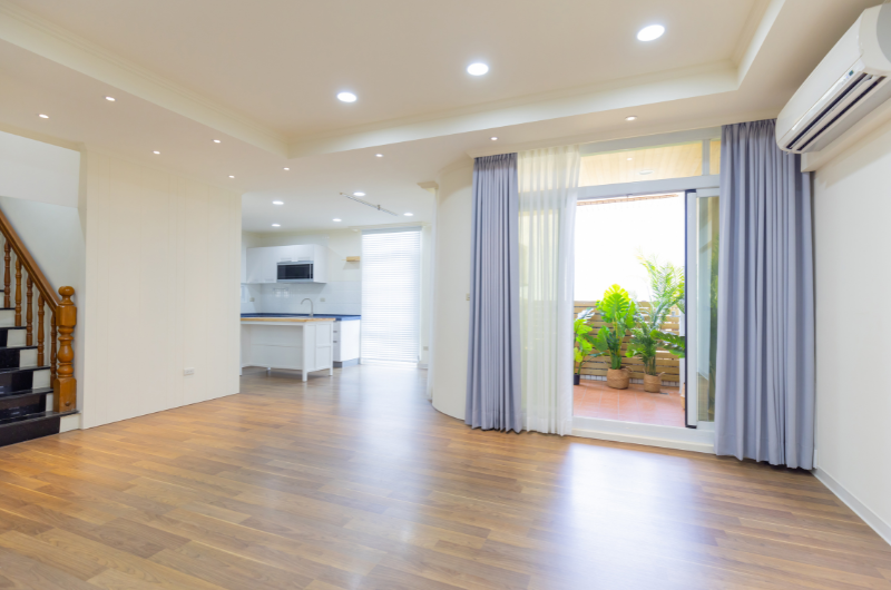 Inside living room of cold house with laminate flooring and underlay